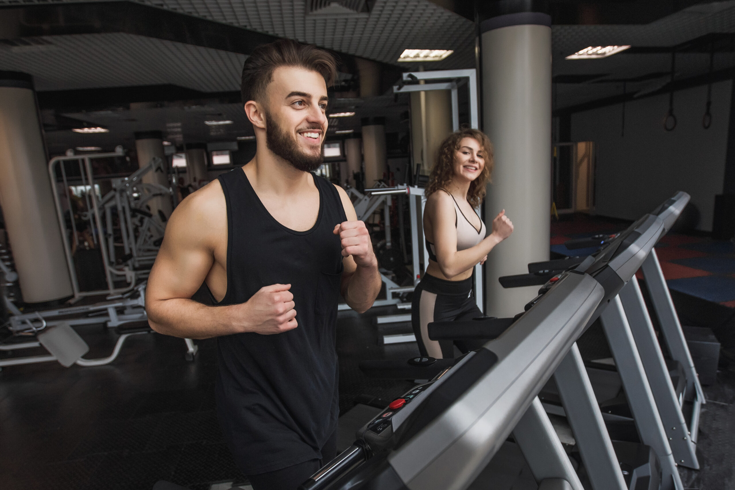 Running time, portrait of young sports couple making cardio work